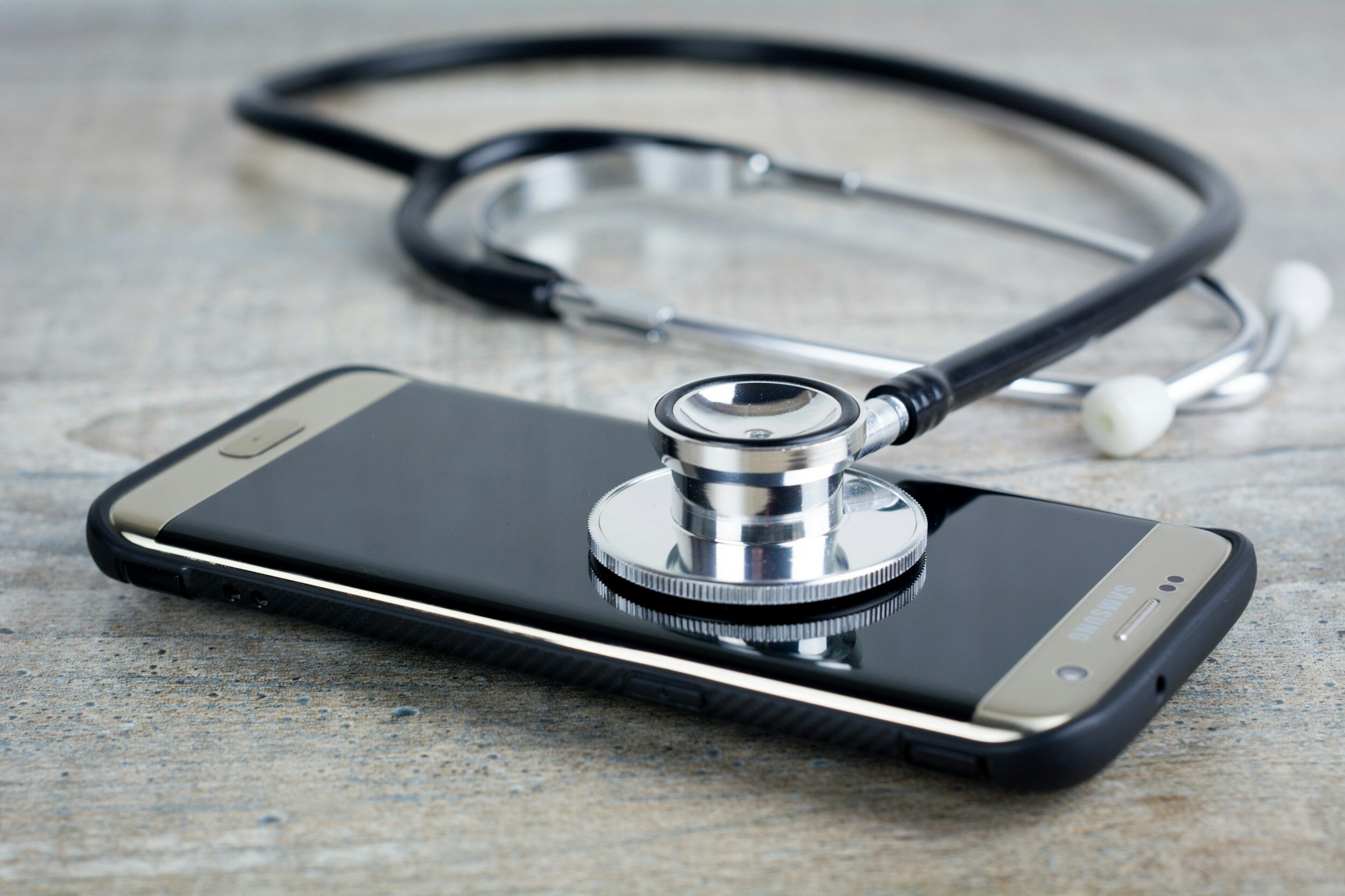 Kranus Health: mobile phone with medical device on it